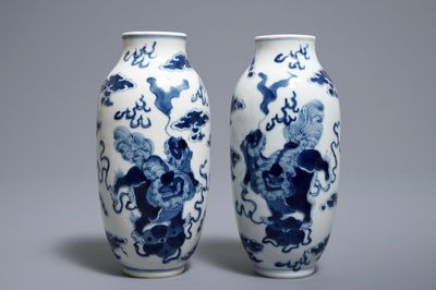 A pair of Chinese blue and white 'buddhist lions' vases, Kangxi mark, 19th C.