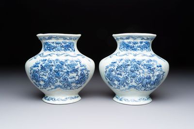 A pair of Chinese blue and white celadon-ground 'Buddhist lions' wall pocket vases, Yongzheng mark, 19/20th C.