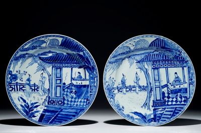 A pair of Chinese blue and white chargers with a scene from "The Romance of the Western Chamber", Yongzheng