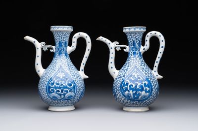 A pair of Chinese blue and white ewers with floral design, Kangxi