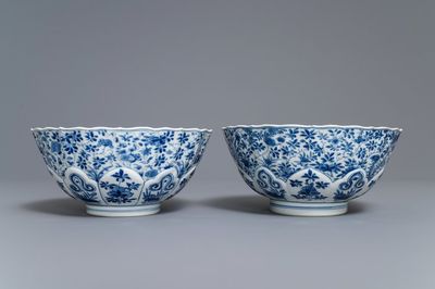 A pair of Chinese blue and white floral bowls, Chenghua mark, Kangxi