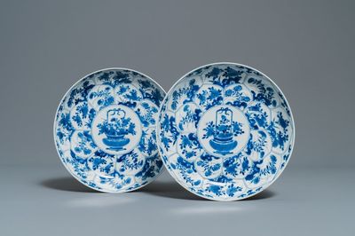 A pair of Chinese blue and white 'flower basket' dishes, Kangxi