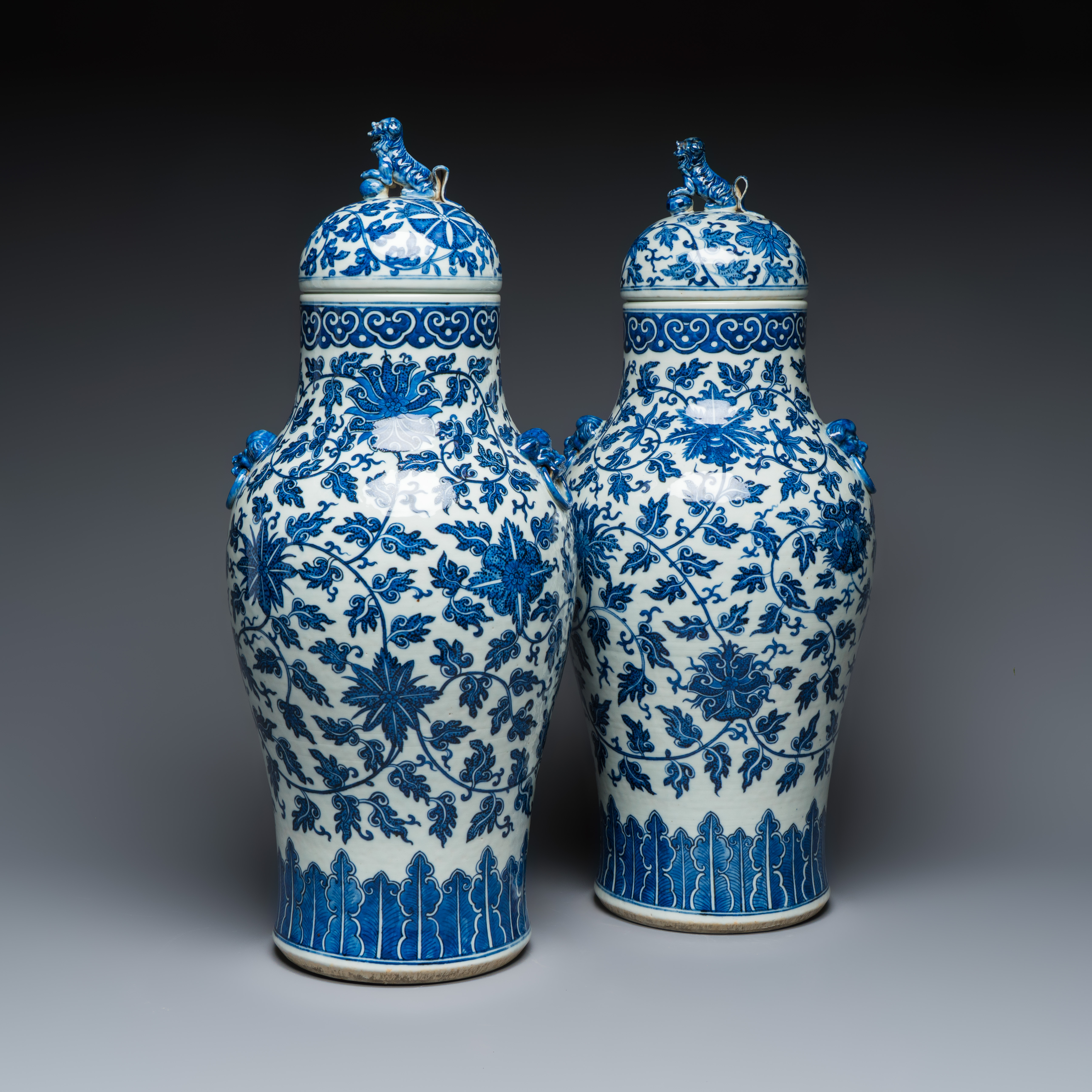 A pair of Chinese blue and white 'Flower Scroll' covered vases, 19th C.