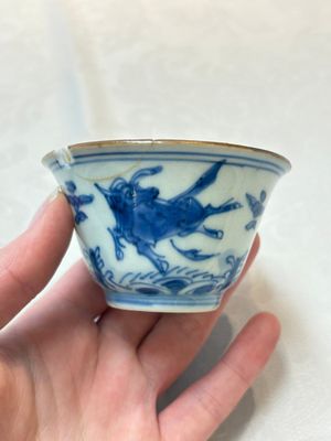 A pair of Chinese blue and white 'flying horses' cups, Jiajing mark, Kangxi — photo 1