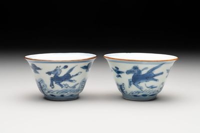 A pair of Chinese blue and white 'flying horses' cups, Jiajing mark, Kangxi