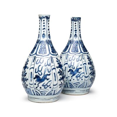 A pair of Chinese blue and white 'Flying Horses' pear-shaped bottle vases, Wanli