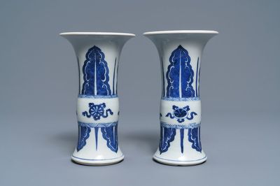 A pair of Chinese blue and white 'gu' vases, Kangxi