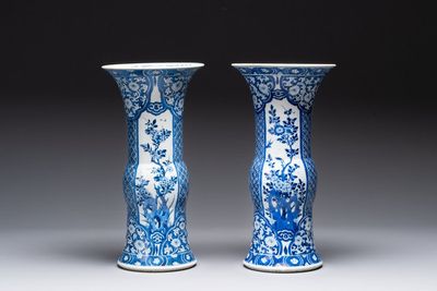 A pair of Chinese blue and white 'gu' vases with floral design, Kangxi
