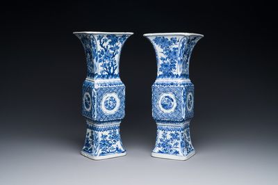 A pair of Chinese blue and white 'gu' vases with floral design, Kangxi