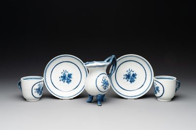 A pair of Chinese blue and white handled cups and saucers and a milk jug, Qianlong/Jiaqing