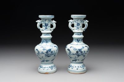 A pair of Chinese blue and white handled vases with floral design, Ming