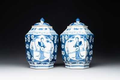 A pair of Chinese blue and white hexagonal jars and covers with a lady holding a fan, 19th C.