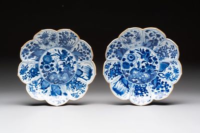 A pair of Chinese blue and white lotus-form 'grasshopper' plates, Kangxi