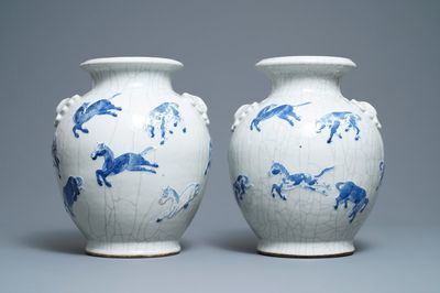 A pair of Chinese blue and white Nanking crackle-glazed vases with horses, 19th C.