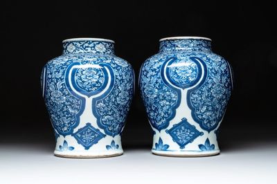 A pair of Chinese blue and white 'peony scroll' vases, Kangxi