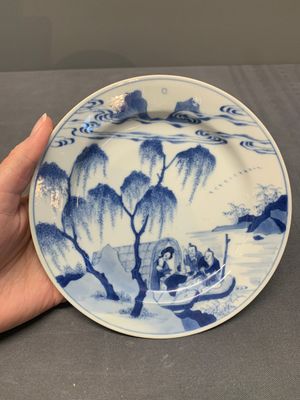 A pair of Chinese blue and white plates with a breastfeeding woman and fishermen on boats, Chenghua mark, Kangxi — photo 2