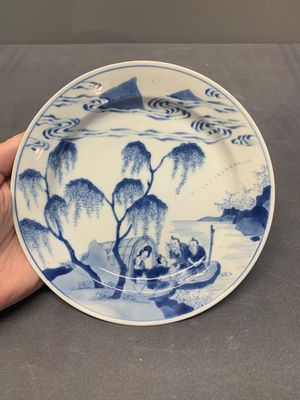 A pair of Chinese blue and white plates with a breastfeeding woman and fishermen on boats, Chenghua mark, Kangxi — photo 4
