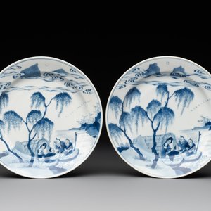 A pair of Chinese blue and white plates with a breastfeeding woman and fishermen on boats, Chenghua mark, Kangxi — photo 1
