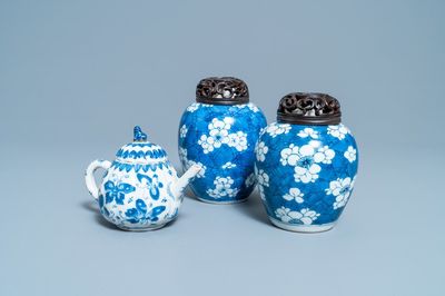 A pair of Chinese blue and white 'prunus on cracked ice' jars and a 'butterfly' teapot and cover, Kangxi