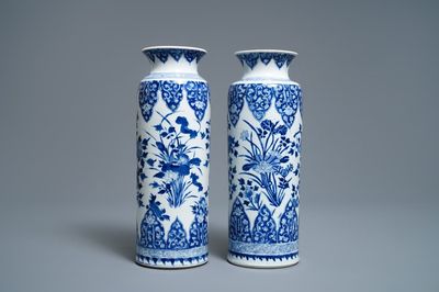 A pair of Chinese blue and white rouleau vases, Kangxi