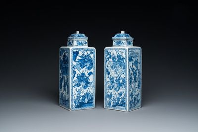 A pair of Chinese blue and white square 'narrative subject' vases and covers, Kangxi