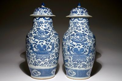 A pair of Chinese blue and white vases and covers, 19th C.