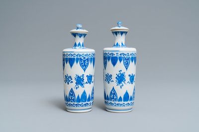 A pair of Chinese blue and white vases and covers, Kangxi
