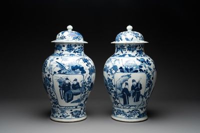 A pair of Chinese blue and white vases and covers with figural panels, 19th C.