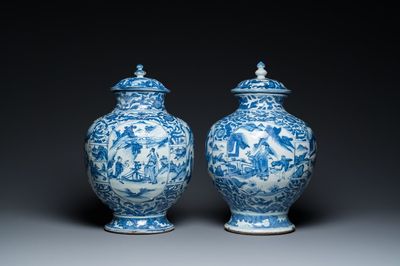 A pair of Chinese blue and white vases and covers with figurative design, Ming