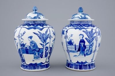 A pair of Chinese blue and white vases and covers with long Elizas, 19th C.