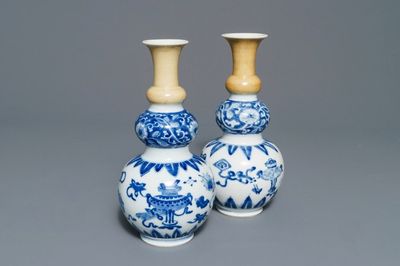 A pair of Chinese blue and white with cafe-au-lait triple gourd vases, Kangxi