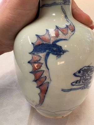 A pair of Chinese blue, white and copper-red 'bats among the clouds' vases, 19th C. — photo 16