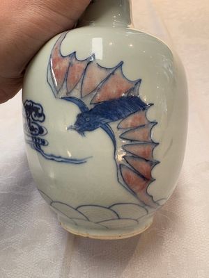 A pair of Chinese blue, white and copper-red 'bats among the clouds' vases, 19th C. — photo 17