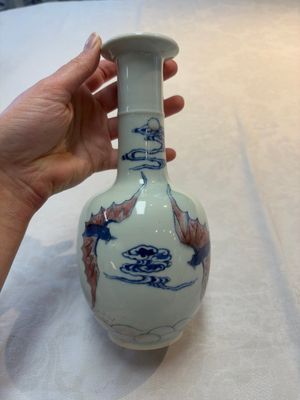 A pair of Chinese blue, white and copper-red 'bats among the clouds' vases, 19th C. — photo 2