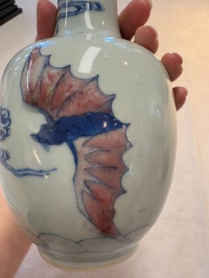 A pair of Chinese blue, white and copper-red 'bats among the clouds' vases, 19th C. — photo 9