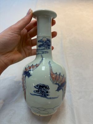 A pair of Chinese blue, white and copper-red 'bats among the clouds' vases, 19th C. — photo 10