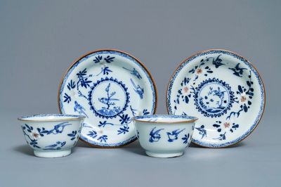 A pair of Chinese blue, white and underglaze red cups and saucers, Kangxi