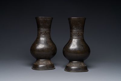 A pair of Chinese bronze 'hu' vases with Taotie design, Song/Yuan