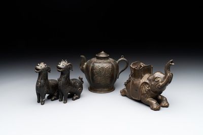 A pair of Chinese bronze mythical creatures and two ewers, Ming