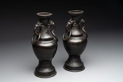 A pair of Chinese bronze vases with 'dragon' handles, Yuan/Ming