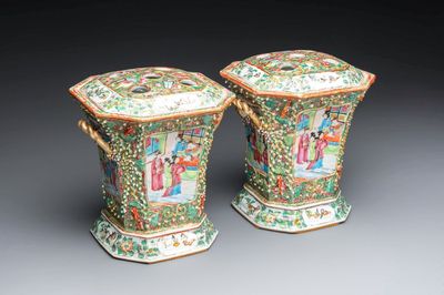 A pair of Chinese Canton famille rose flower holders and covers with figural design, 19th C.