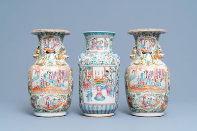 A pair of Chinese Canton famille rose vases and a single vase, 19th C.