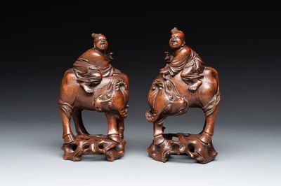 A pair of Chinese carved bamboo groups of a boy riding a buffalo, 19/20th C.