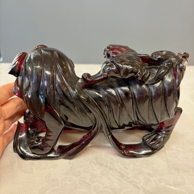 A pair of Chinese carved cherry amber 'Buddhist lions' groups — photo 4
