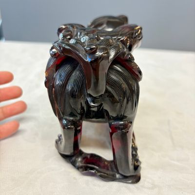 A pair of Chinese carved cherry amber 'Buddhist lions' groups — photo 5