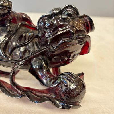 A pair of Chinese carved cherry amber 'Buddhist lions' groups — photo 6