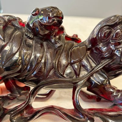 A pair of Chinese carved cherry amber 'Buddhist lions' groups — photo 7
