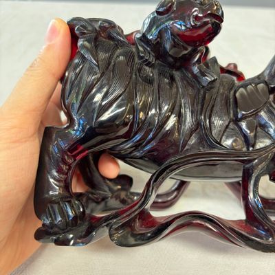 A pair of Chinese carved cherry amber 'Buddhist lions' groups — photo 8