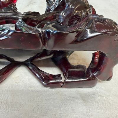A pair of Chinese carved cherry amber 'Buddhist lions' groups — photo 11
