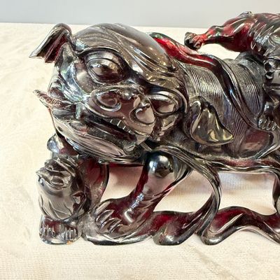 A pair of Chinese carved cherry amber 'Buddhist lions' groups — photo 14
